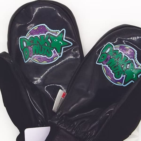 Black Dank Donuts mittens with a green and purple logo featuring a donut and stars.