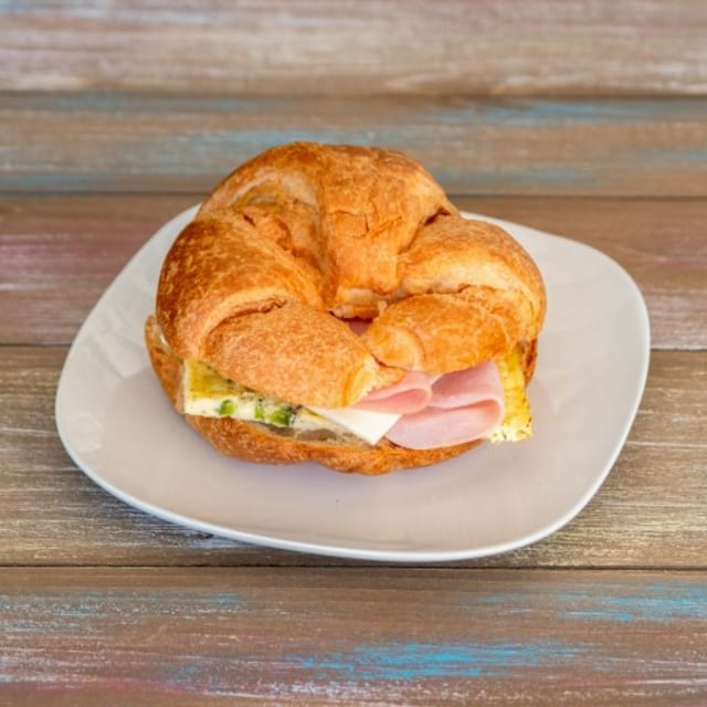 Ham, Egg, Cheese, and Jalapeño Croissant Sandwich.